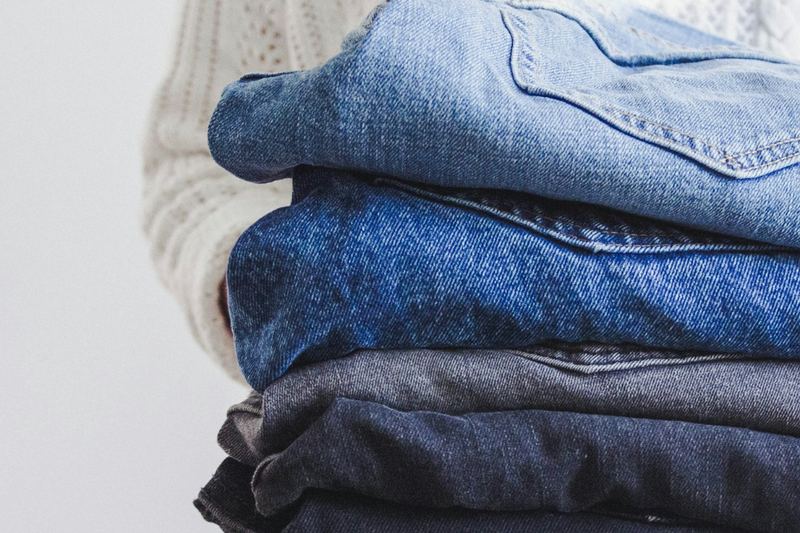 A stack of clean, folded jeans